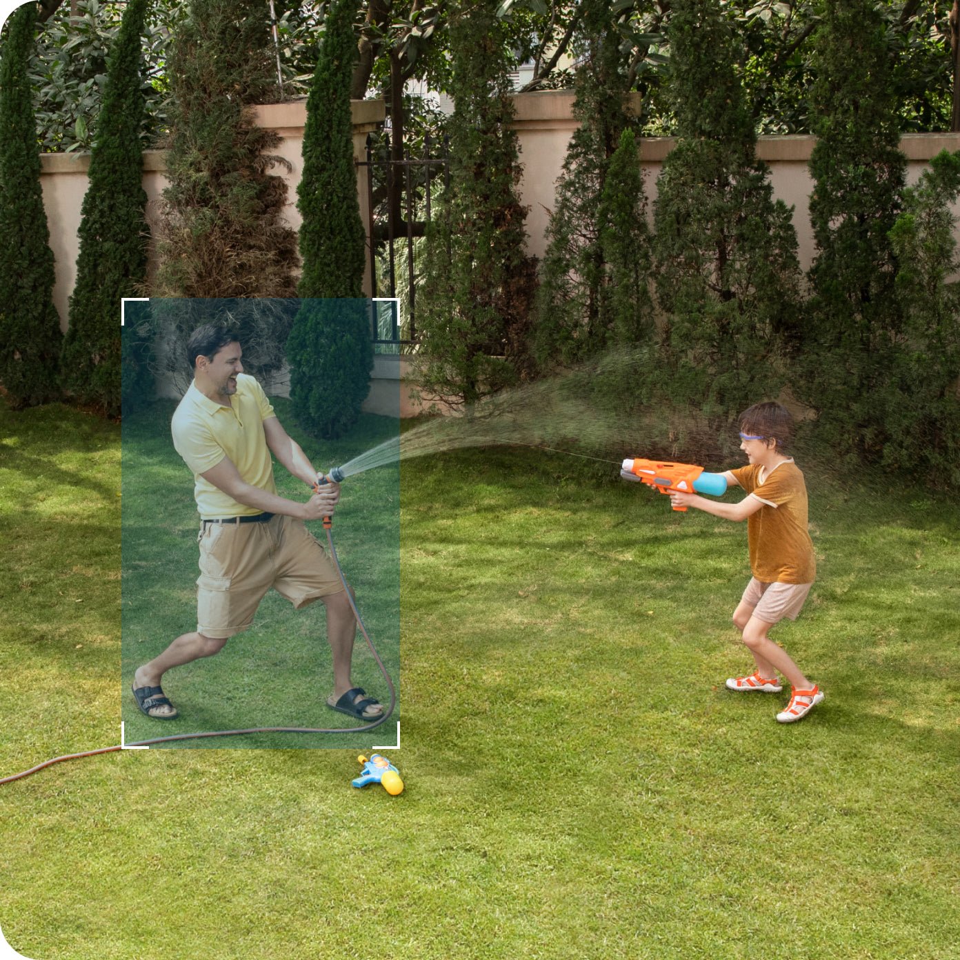 eufy Bewegungserkennung für spielende Familie mit Wasser